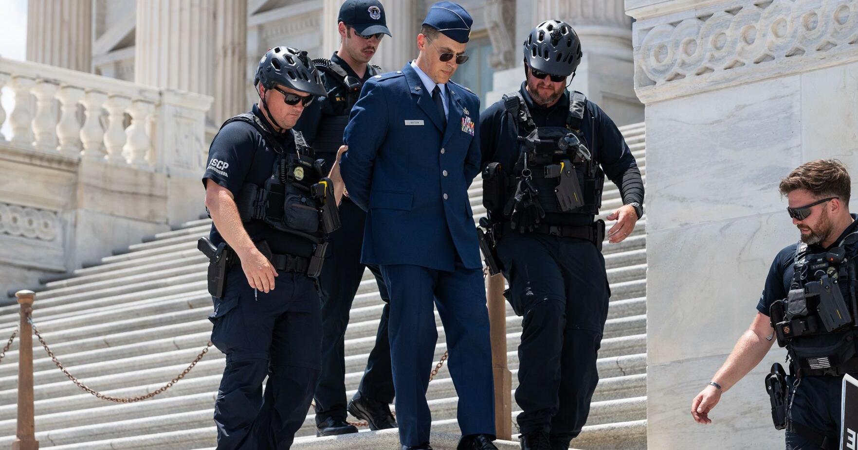Trump criticism leads to rare criminal charges for Air Force officer who called for impeachment