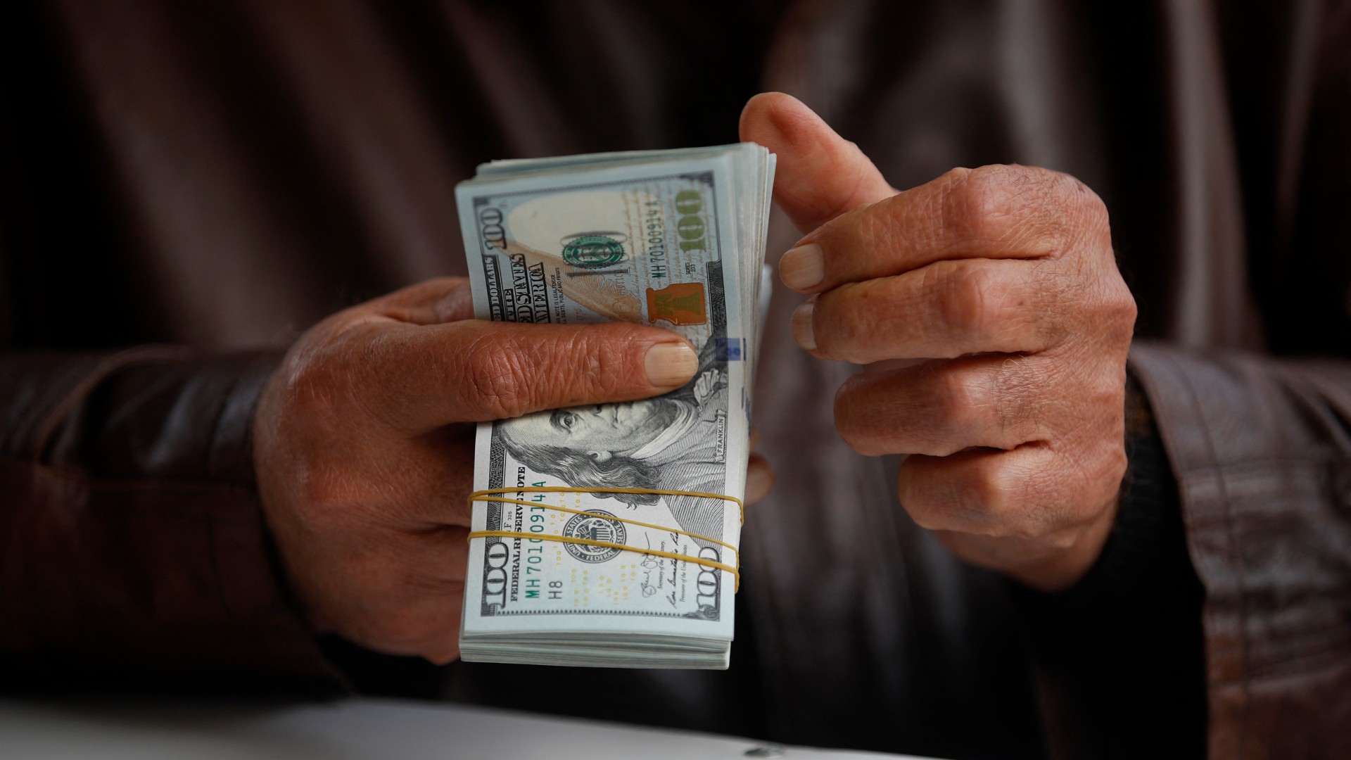 Why does the US control Iraq's oil revenues?